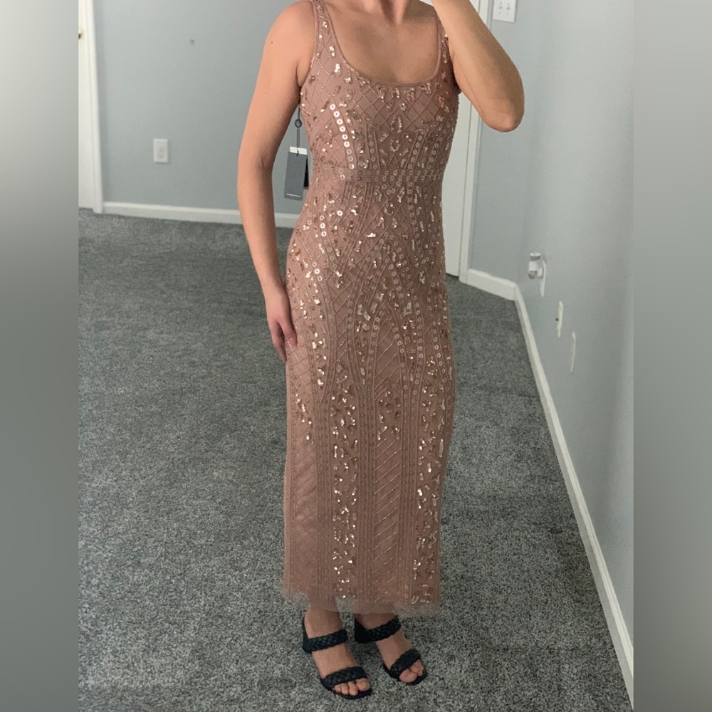 Brand new beaded cocktail dress with tags still attached size 2, color rose gold